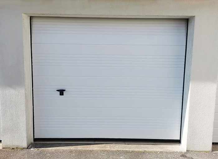 Photo après Relaquage porte de garage sectionnelle